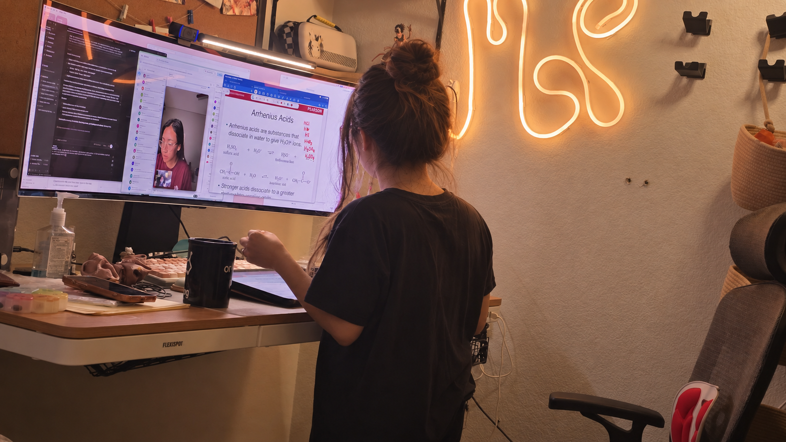 Adrianne Penullar at her standing desk during a chemistry coaching session